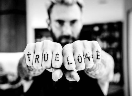 Adam Levine's "True Love" knuckle tattoo